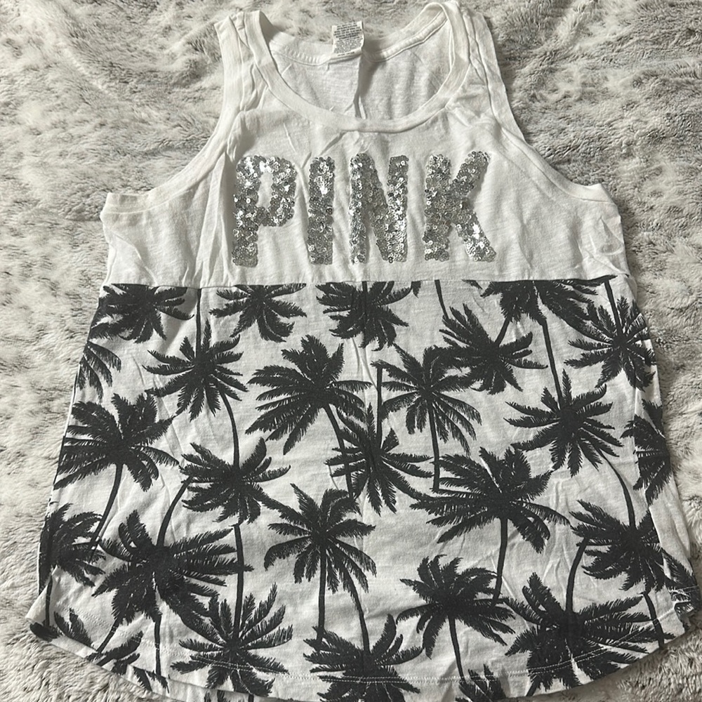 Tank top . White with black palm trees , the words pink in silver sequins